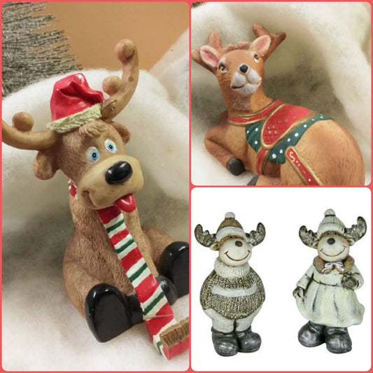 negozio alce renne rosso grigio terracotta ceramica uso animali del bosco per decorazioni con Babbo Natale fai da te addobbi natalizi vetrine fondale nastro tessuto peluche bianco