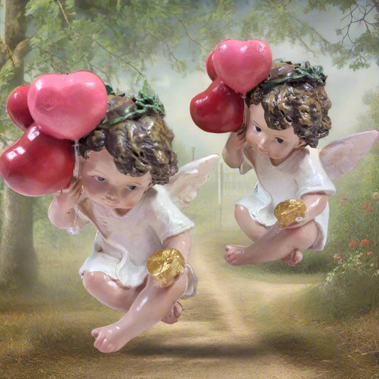 profilo di statuette angelo cupido san valentino confezione regalo cuoricini palloncini rossi angioletto seduto cuore dorato oggettistica regalo vetrinistica