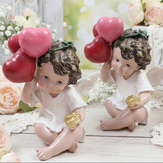 profilo di statuette angelo cupido san valentino confezione regalo cuoricini palloncini rossi angioletto seduto cuore dorato oggettistica regalo vetrinistica