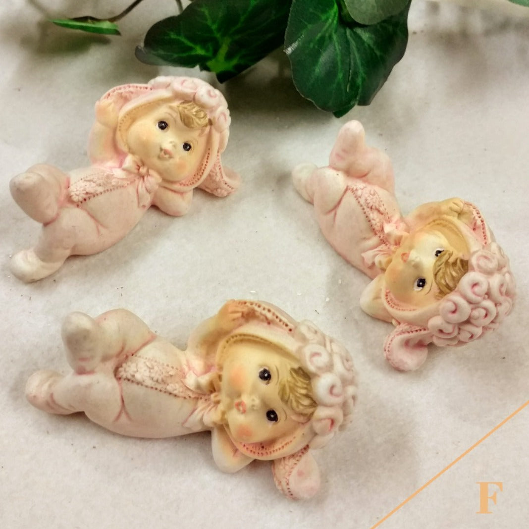 bimbe pigiamino rosa shop online negozio ricordini oggettini regalini bomboniere baby shower nascita Battesimo assortimento rosa bianco