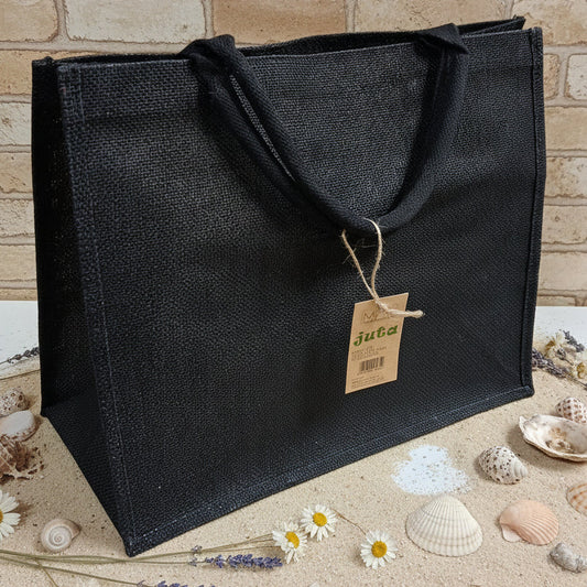 colore nero colorata estiva spiaggia mare piscina juta borsa rettangolare manici tessuto yuta da decorare rivestire uncinetto tecnica applicazioni personalizzare dipingere colorare ricamare fiori bianchi conchiglie appliquè pizzo nappine pompons