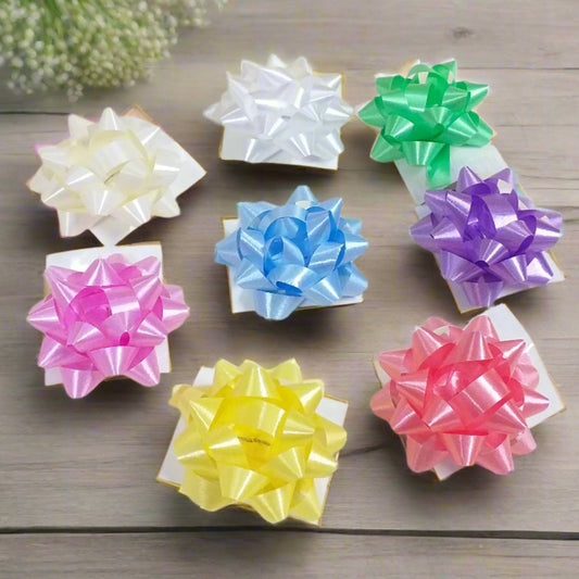 forma stella carta tinte tenui pastello coccardine fiocco chiudipacco per confezione regalo Natale Pasqua segnaposto bomboniere fai da te packaging San Valentino vetrinistica