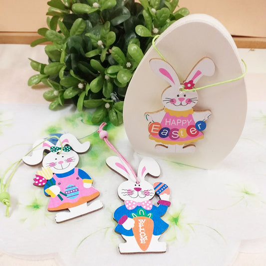 uovo legno ciondoli coniglietti pasquali colorati arancio rosa blu happy easter scritta welcome uova fiori uso packaging segnaposto idea regalo sorpresa ovetti cioccolato gadget souvenir