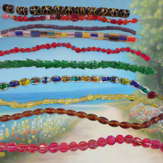 viola rosse blu verdi colori misti forme assortite varie serie colorate perle di vetro veneziano stile Murano vendita a fili shop offerta stock fai da te bigiotteria collane bracciali