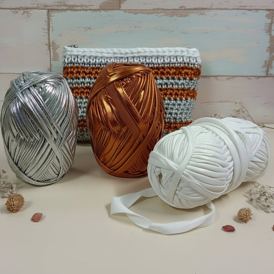 bianco argento arancio cangiante madreperlato shop MAS fettuccia lycra laminata metallizzata lamè lurex iridescente gomitoli uso uncinetto ferri da maglia pochette clutch bags portamonete portaocchiali