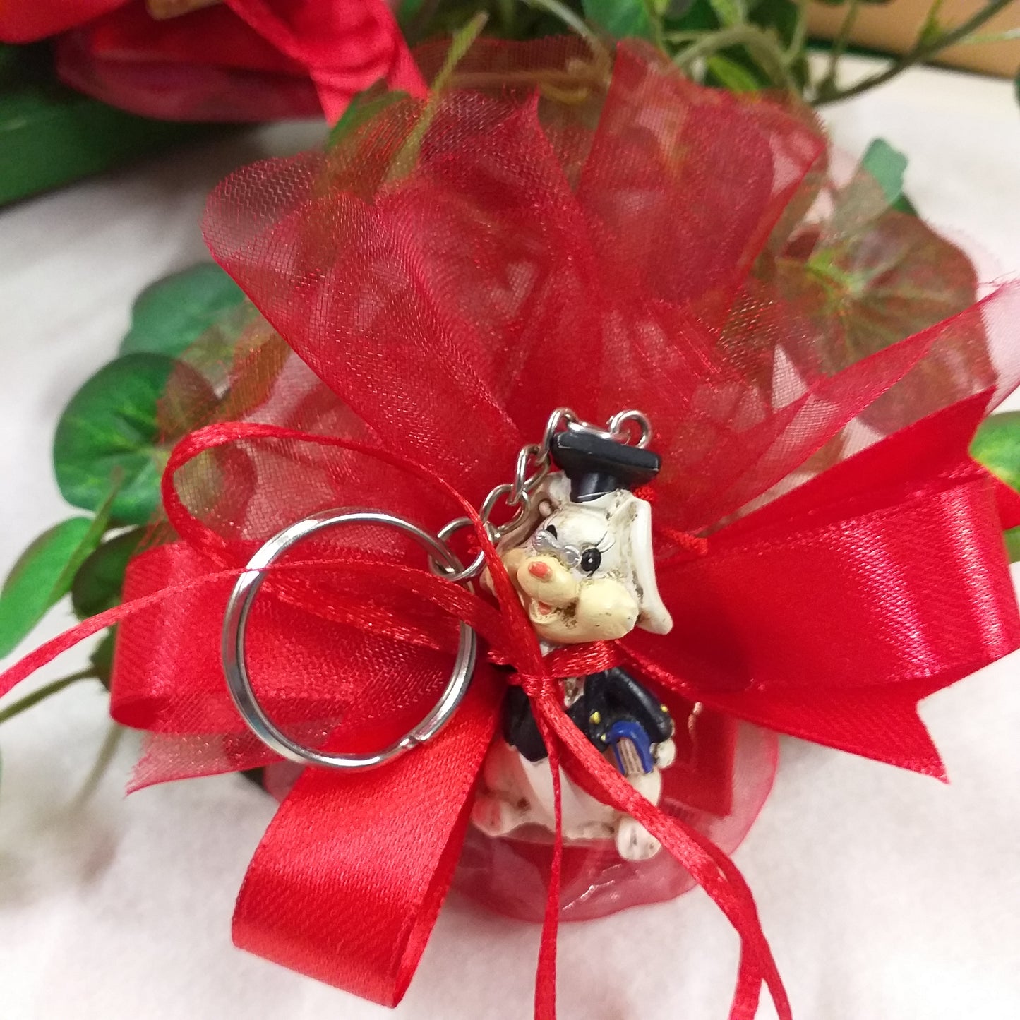 idea italian bomboniera laurea sacchetto rosso confezionato confetti ricordino portachiavi oggetto spiritoso portafortuna animaletto tocco cappello nappina rossa