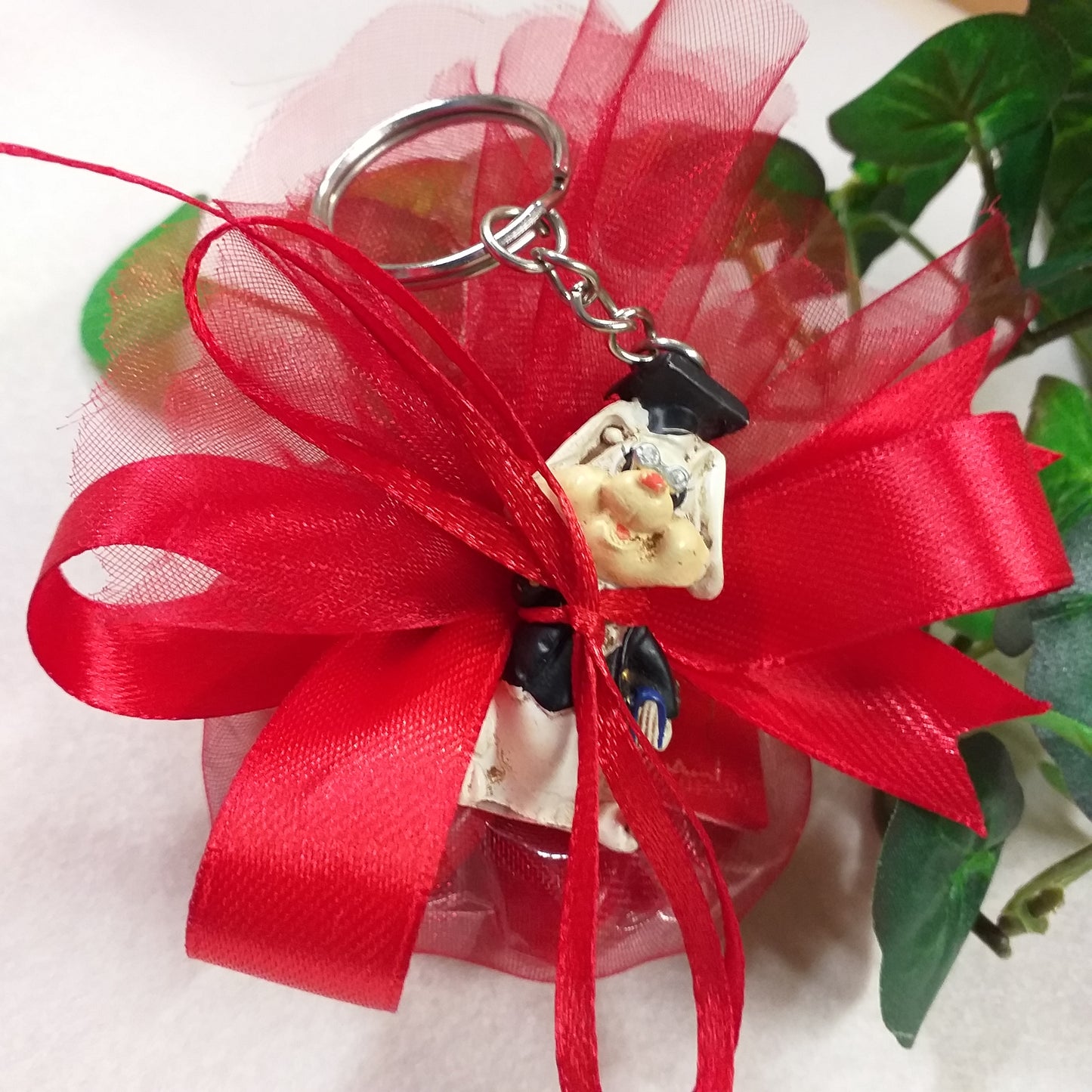 italian bomboniera laurea sacchetto rosso confezionato confetti ricordino portachiavi oggetto spiritoso portafortuna animaletto tocco cappello nappina rossa