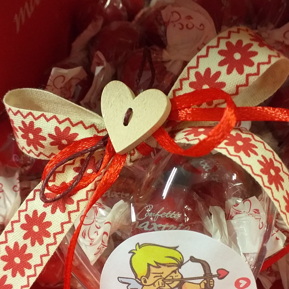 bomboniera cuore plastica trasparente confezionato confetti maxtris bon bon cream incartato come caramella singolarmente per segnaposto cuoricino legno