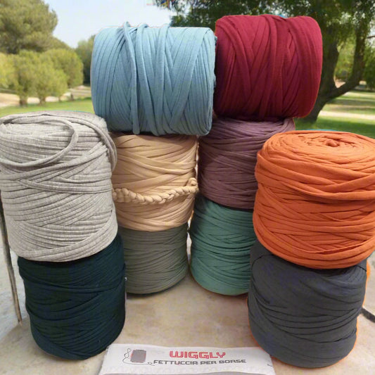 lilla pastelli burro beige rosa verde blu avio viola ottanio cucirini tre stelle wiggly fettuccia borse uncinetto filato cotone elastico crochet bag clutch progetti pochette borsette da sera cerimonia natalizie cestini pasquali tappeti arancione