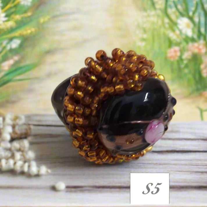 pietra con fiorellino rosa, rame e shop anelli artigianali fatti a mano bigiotteria di perline perle pietre intrecciati bijoux  con filo e basi cristalli Swarovski componenti di murano