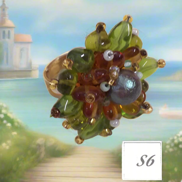ambra topazio verde olive a margherita shop anelli artigianali fatti a mano bigiotteria di perline perle pietre intrecciati bijoux con filo e basi cristalli Swarovski componenti di murano