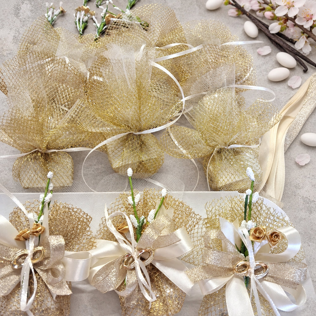 working in progress confezionamento bomboniere nozze oro con fedi applicazioni anniversario matrimonio