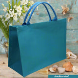 turchese teal colorata estiva spiaggia mare piscina juta borsa quadrata 30 x 30 cm manici tessuto yuta da decorare rivestire uncinetto tecnica applicazioni personalizzare dipingere colorare ricamare fiori bianchi conchiglie appliquè pizzo nappine pompons