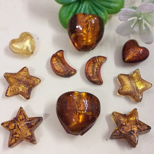 forme assortite cuore luna stelle colori oro ambra  charms ciondoli negozio online vendita perle vetro Murano pendenti fai da te gioielli bijoux di bigiotteria perline