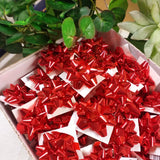 forma stella carta metallizzata coccarde fiocchi rossi chiudipacco per confezione regalo Natale segnaposto capodanno packaging San Valentino vetrinistica
