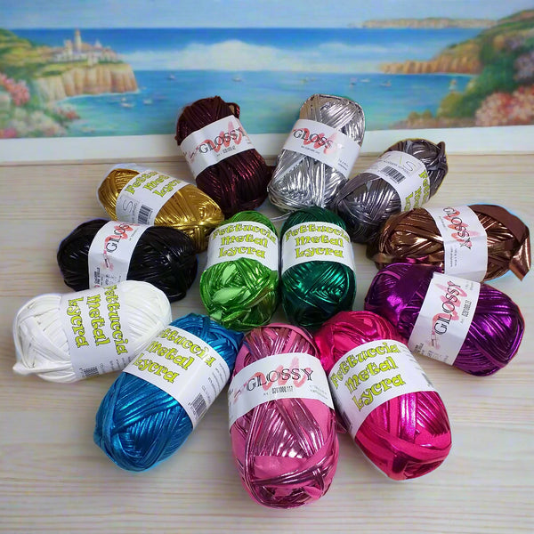 vetrina oro argento marrone e colori turchese rosa fucsia verde bianco perlato glossy cucirini tre stelle fettuccia lamè metallica metallizzata simil-pelle ecopelle verniciata per borse uncinetto clutch bags estate 2025