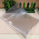 foglio di cellophane trasparente 100 x 130 cm piegato uso confezioni cesti kit packaging regalo fioristi artigianato fai da te