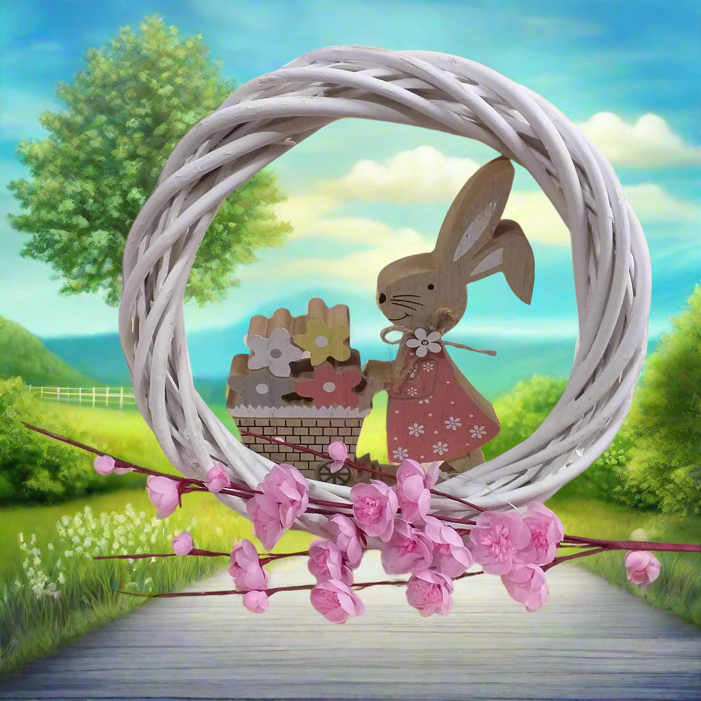 idea fai da te applicazione packaging confezione regalo ghirlanda fuoriporta coroncina con ramo grande vetrina fiori di pesco finti artificiali rosa chiaro composizione piantina addobbi decorazioni vetrine negozio primavera pasquale coniglietto