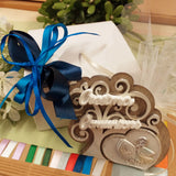 blu e bluette packaging icona sacra religiosa ricordino oggetto albero della vita legno resina gesso simboli scritta Comunione Cresima confezionata confetti tulle scatola coccarda bigliettino