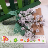 creare mughetti perline fiori bianchi per bomboniere matrimonio bouquet sposa centrotavola rocailles beads conteria bianco verde