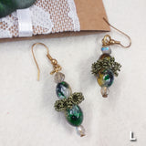 orecchini fatti a mano con pietre perline artigianali di pendenti particolari intreccio perle offerte con cristalli swarovski verde e cristallo con monachelle