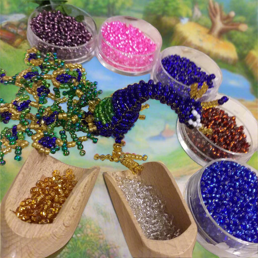 rocailles beads idea fai da te hobby perline creare animaletti pavone con conteria di vetro Stafil interno argento colori cristallo viola azzurro blu rosa rame