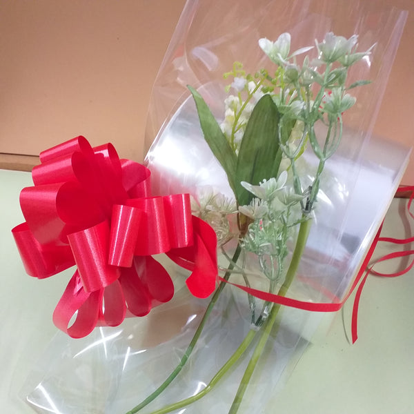 sacchetti aperti di cellophane trasparenti buste per fiori e rose forma tubolare, idea confezionare mughetti fiocco rosso