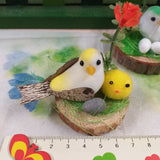 confezioni segnaposto pasquale uccellino pulcino gialli ovetto fiori e tronco legno corteccia riempitivo paglietta verde sisal uso packaging chiudipacco regalo