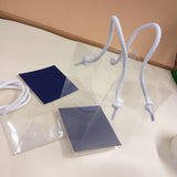 dall'alto shopper box trasparente con cordini di plastica scatola regalo aperta porta bomboniere per confezionamento gadgets souvenir regalini ricordini packaging fai da te confezioni