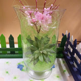 visione frontale vaso di vetro composizione fiori finti di pesco piantina grassa artificiale per centrotavola vetrinistica fili di erba sisal verde riempitivo idea regalo pasquale