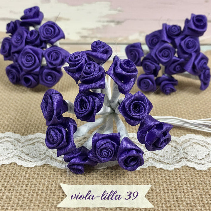 colorviola-lilla rose fiori confetti bomboniere fai da te applicazioni con stelo gambo stoffa raso satin roselline uso hobbistica confezionamento regali chiudipacco fermacapelli fasce acconciature