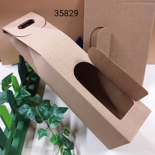 Vetrina negozio confezioni regalo per bottiglie vino spumante champagne scatole da una bottiglia di cartoncino beige naturale onda avana