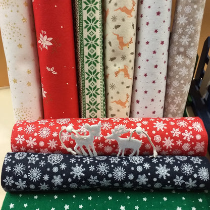negozio vetrina pannolenci stampato natalizio feltro morbido fantasia melange fiocco di neve tirolese renne stelline ad uso creazioni addobbi albero Natale decorazioni vetrinistica bambole gnomi angioletti