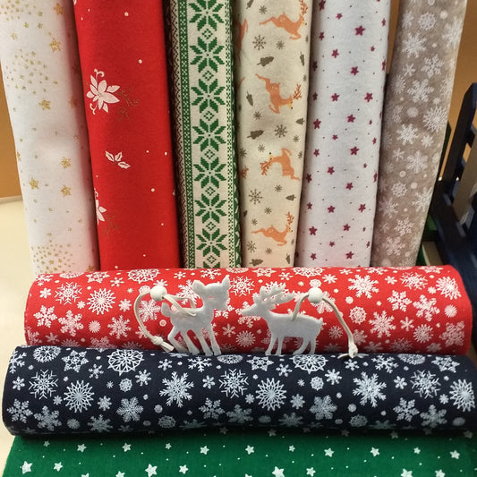 negozio vetrina pannolenci stampato natalizio feltro morbido fantasia melange fiocco di neve tirolese renne stelline ad uso creazioni addobbi albero Natale decorazioni vetrinistica bambole gnomi angioletti
