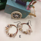 forma cerchio shop online retrò orecchini particolari artigianali bigiotteria etnica perline colorate conchiglie perle cocco pietre, metallo wire