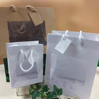 scatole shopper bomboniere box bag buste regalo di cartoncino tinta unita bianco beige avana kraft cartone con manici corda
